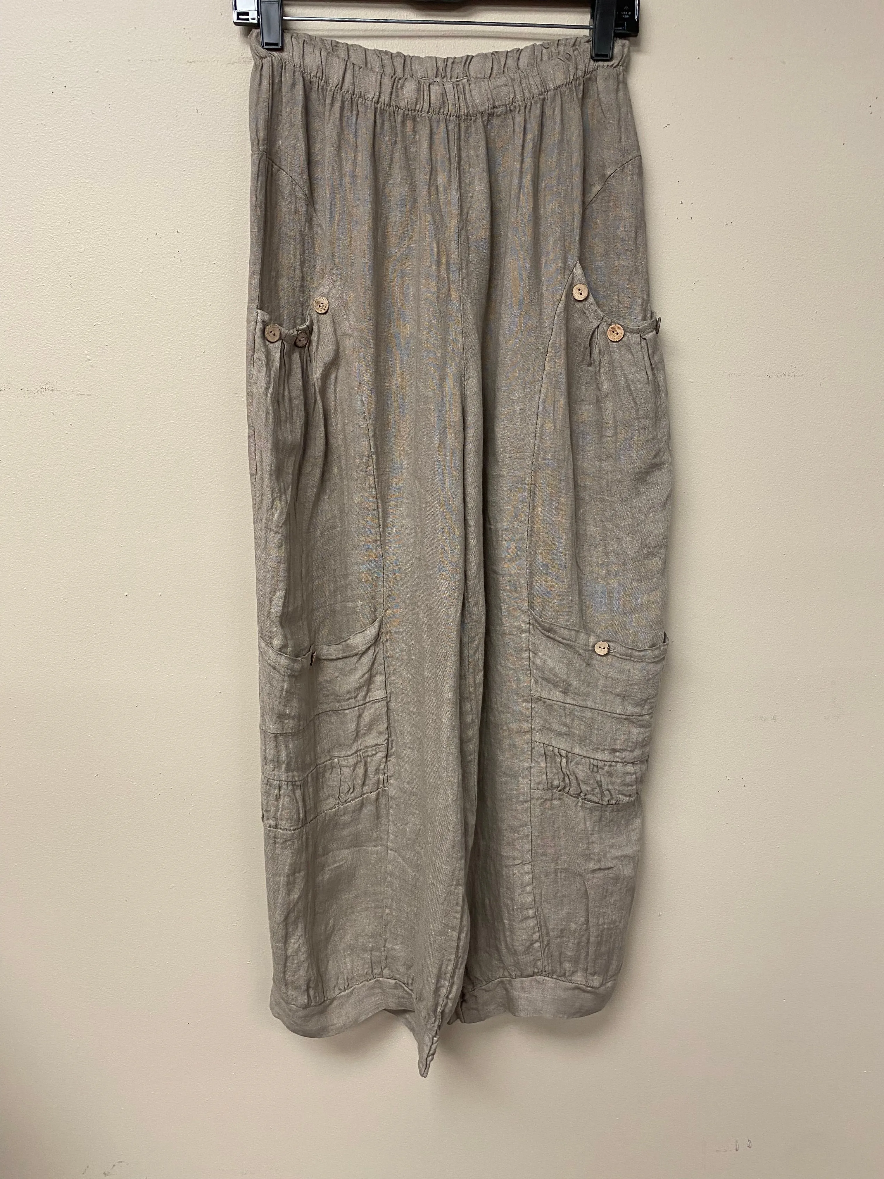 Four pocket Italian linen pants with button accent.